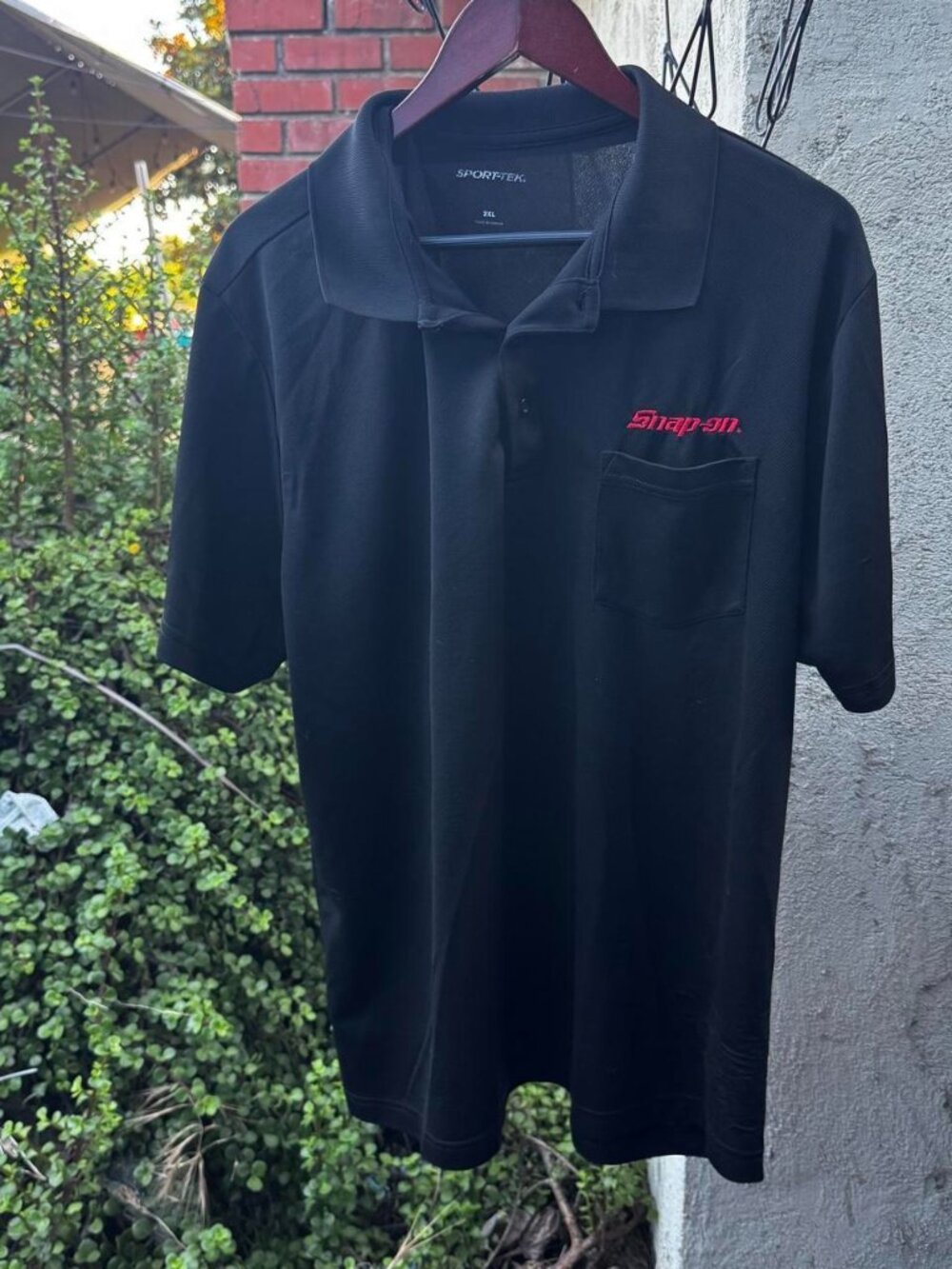 Snap-on black polo shirt